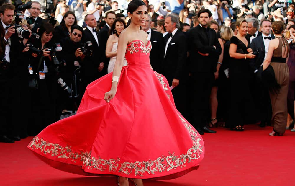 Actress Freida Pinto poses photographers as she arrives for the screening of The Homesman at the 67th international film festival, Cannes, southern France.