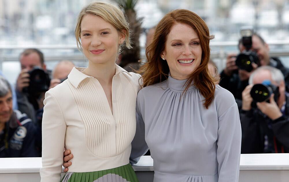 Actress Julianne Moore, right, and actress Mia Wasikowska pose for photographers during a photo call for Maps to the Stars at the 67th international film festival, Cannes, southern France.