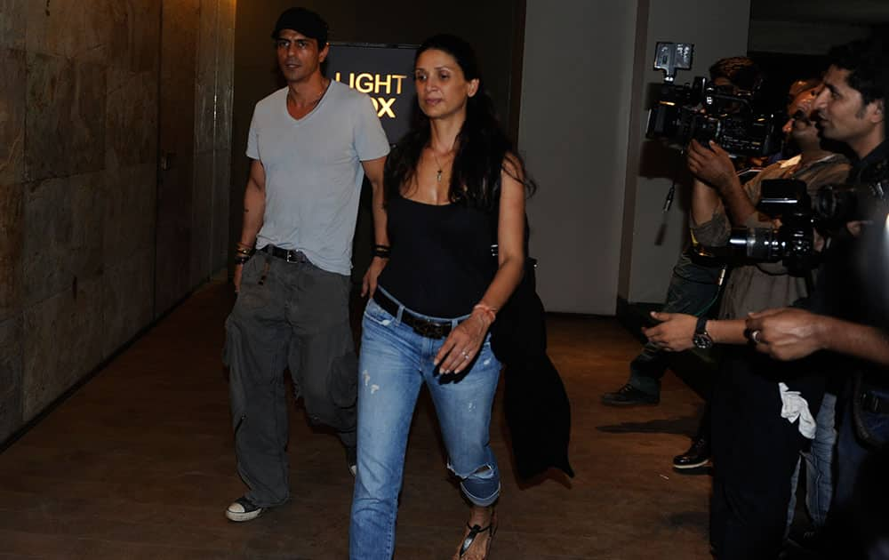 Arjun Rampal (L) and Mehr Jessia at a special screening of 'X-Men: Days of Future Past' in Bandra. dna