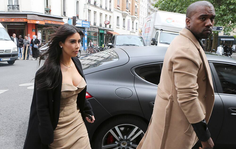 Kim Kardashian and U.S rap singer Kanye West arrive at a luxury shop in Paris. The gates of the Chateau de Versailles, once the digs of Louis XIV, will be thrown open to Kim Kardashian, Kanye West and their guests for a private evening this week ahead of their marriage.