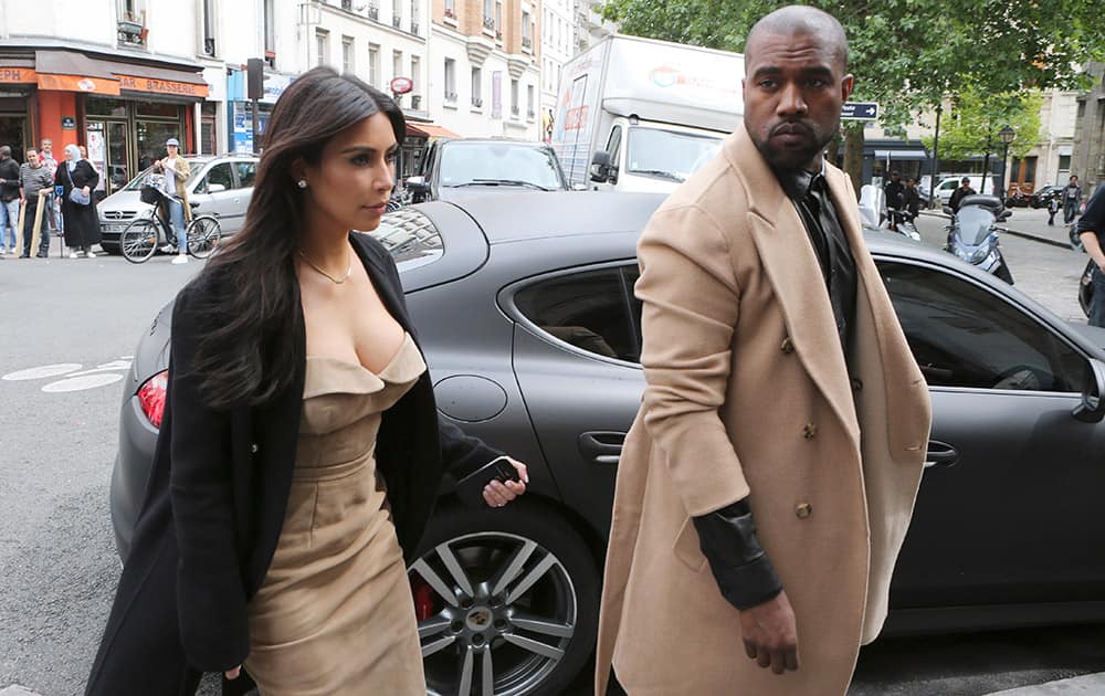 Kim Kardashian and U.S rap singer Kanye West arrive at a luxury shop in Paris. The gates of the Chateau de Versailles, once the digs of Louis XIV, will be thrown open to Kim Kardashian, Kanye West and their guests for a private evening this week ahead of their marriage.