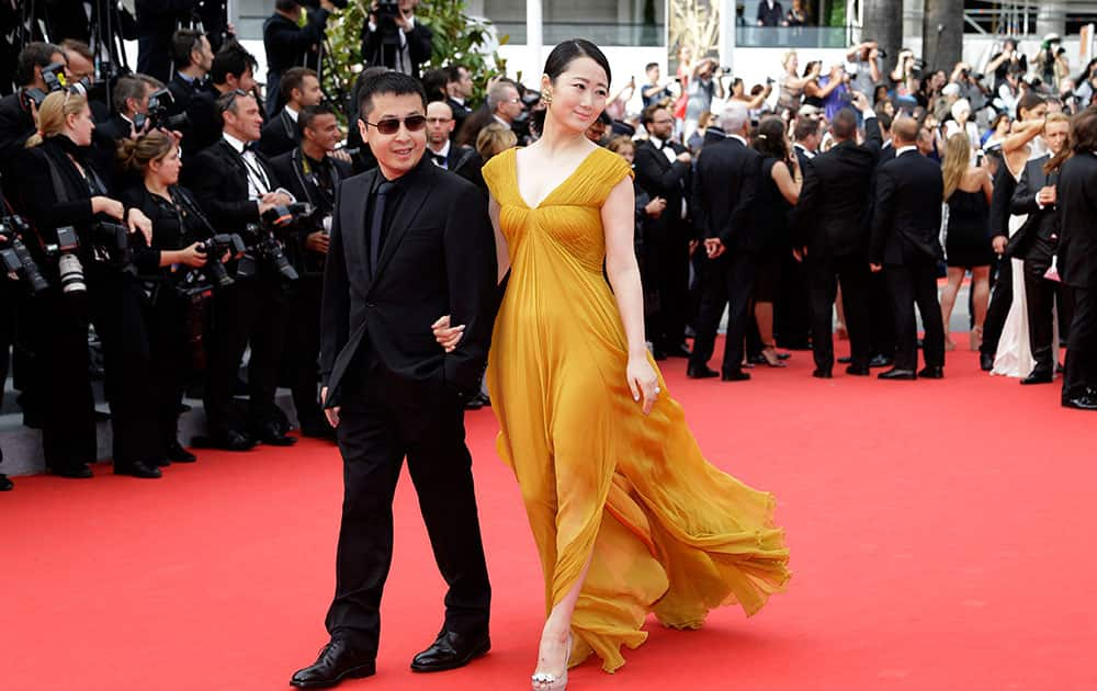 Jury member Jia Zhangke and actress Zhao Tao pose for photographers as they arrive for the screening of The Search at the 67th international film festival, Cannes, southern France.