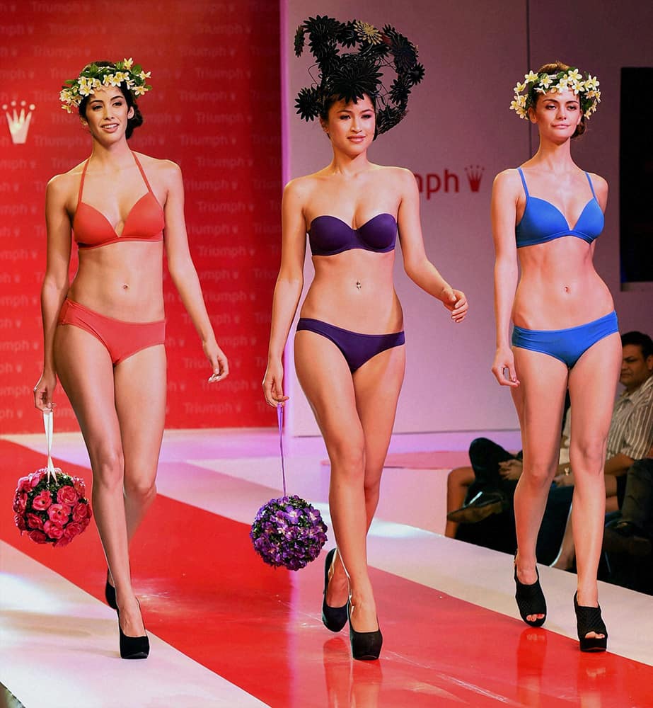 Models showcase creations during Triumph lingerie show in Mumbai.