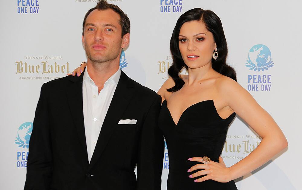 English actor Jude Law poses with English singer Jessie J, before the Peace One Day gala in Monaco.