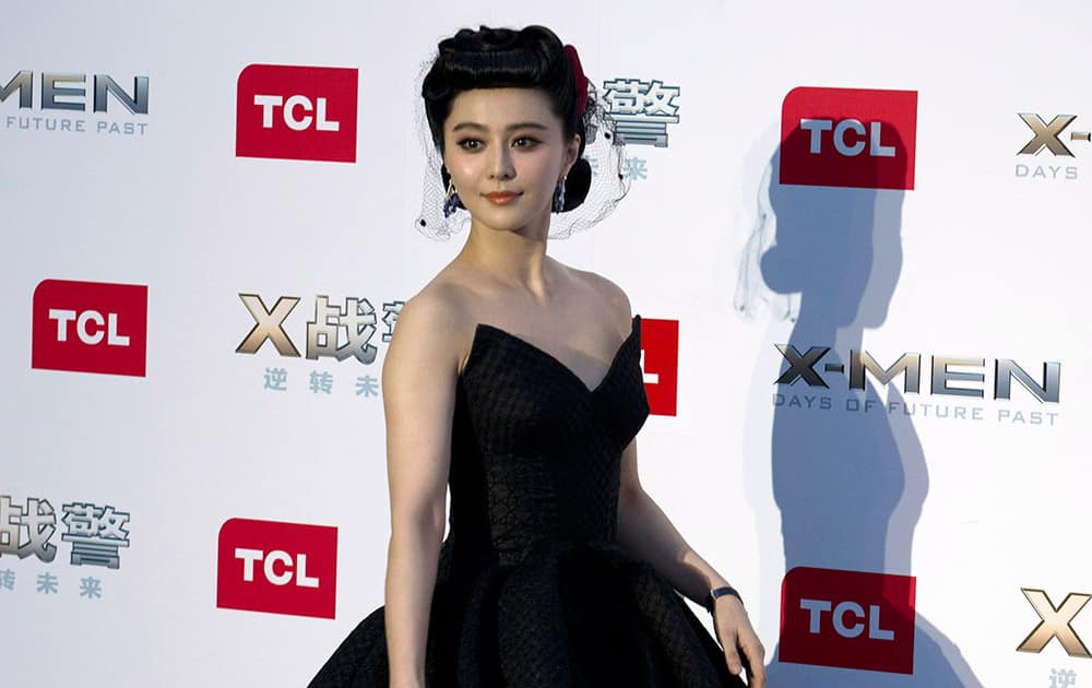 Chinese actress Fan Bingbing poses for photos during the red carpet for her latest movie 'X-Men:Days of Future Past' in Beijing, China.