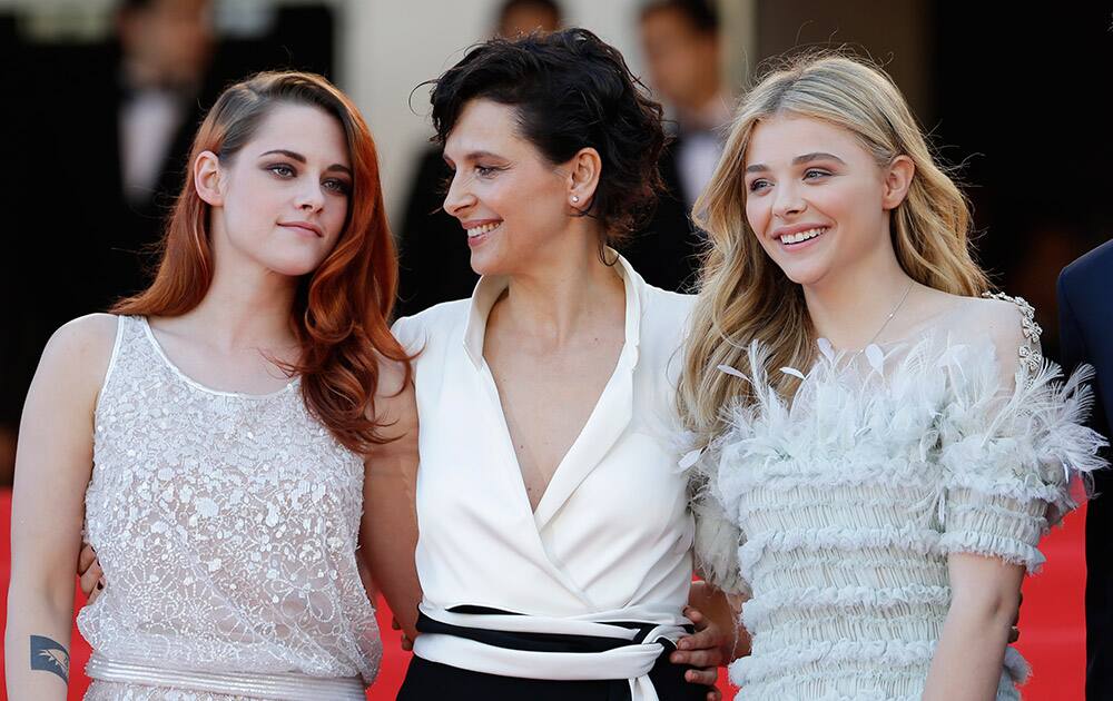 Actress Kristen Steward, Juliette Binoche and Chloe Grace Moretz pose as they arrive for the screening of Sils Maria at the 67th international film festival.