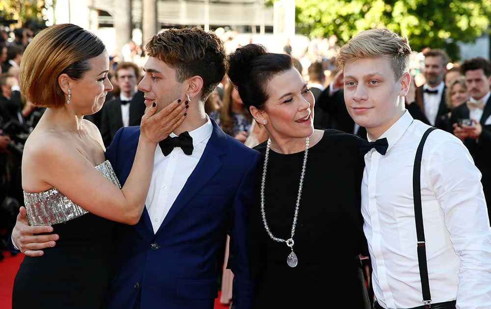 From left, actress Suzanne Clement, director Xavier Dolan, actress Anne Dorval and actor Antoine-Olivier Pilon arrive for the awards ceremony at the 67th international film festival, Cannes, southern France.