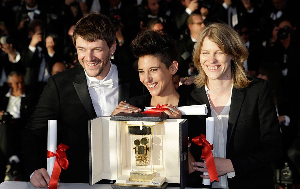 From left, Samuel Theis, Marie Amachoukeli, and Claire Burger pose after winning the Camera d'Or award for the film during a photo call following the awards ceremony at the 67th international film festival, Cannes.