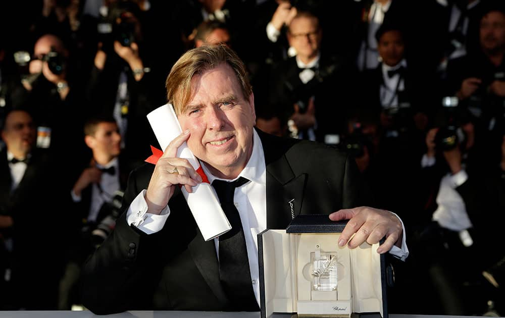 Actor Timothy Spall poses after winning the Best Actor for his role in the film Mr. Turner during a photo call following the awards ceremony at the 67th international film festival, Cannes.