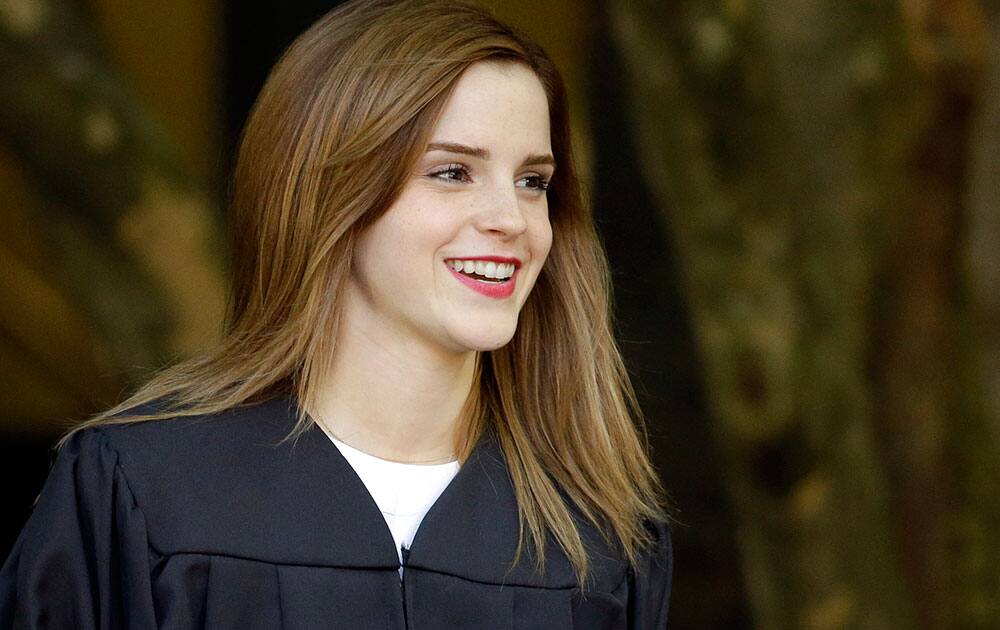 Actress Emma Watson walks between buildings following commencement services on the campus of Brown University, in Providence, R.I. 