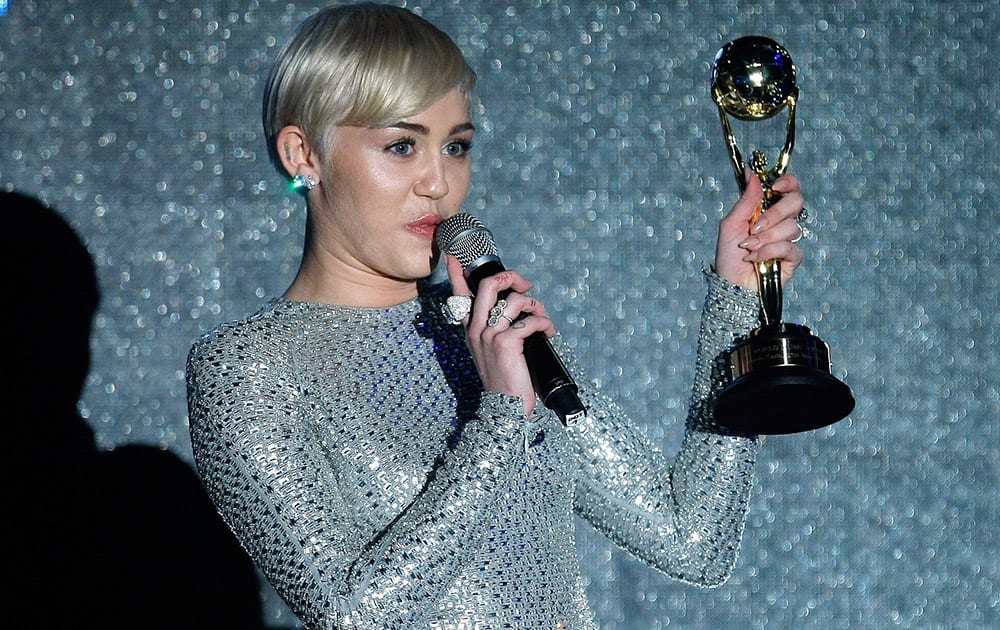 Miley Cyrus receives an award during the World Music Awards in Monaco.