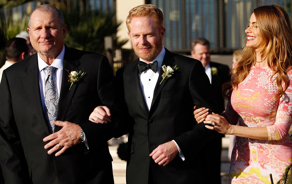 From left, Ed O'Neill, Jesse Tyler Ferguson and Sofia Vergara, in the season finale, `The Wedding, Part 2,` of the series, `Modern Family,` on the ABC Television Network.