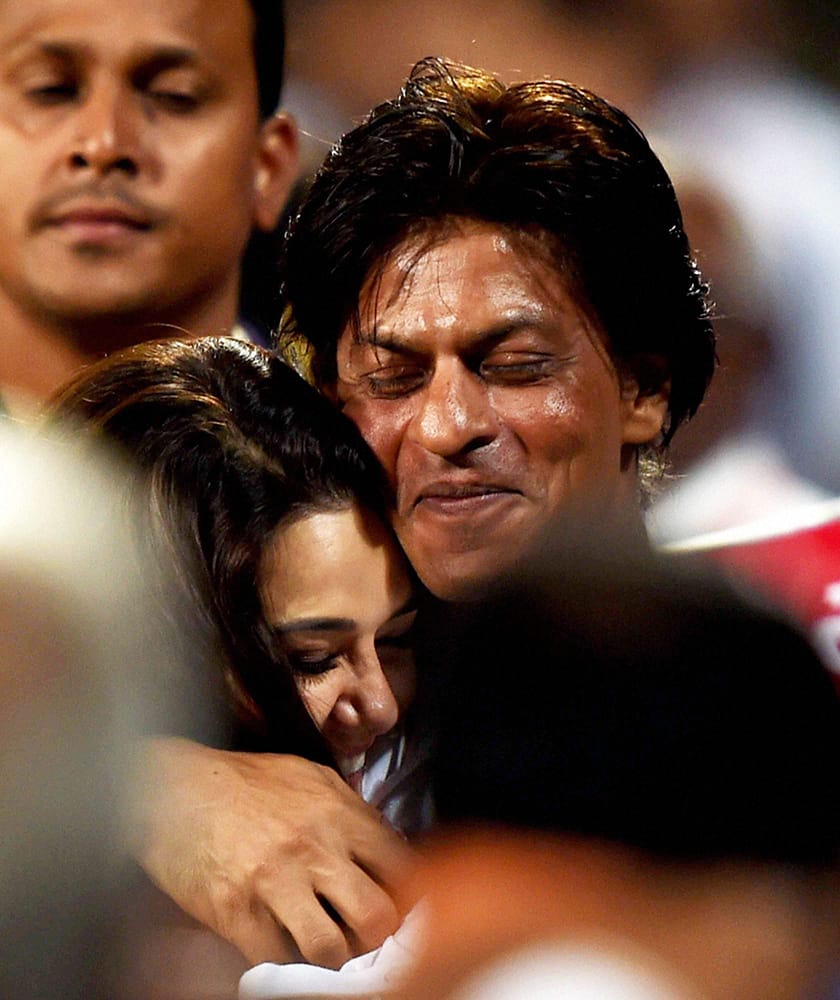 KKR owner Shahrukh Khan and KXIP owner Preety Zinta greets each other at the end of IPL Match at Eden Garden in Kolkata .