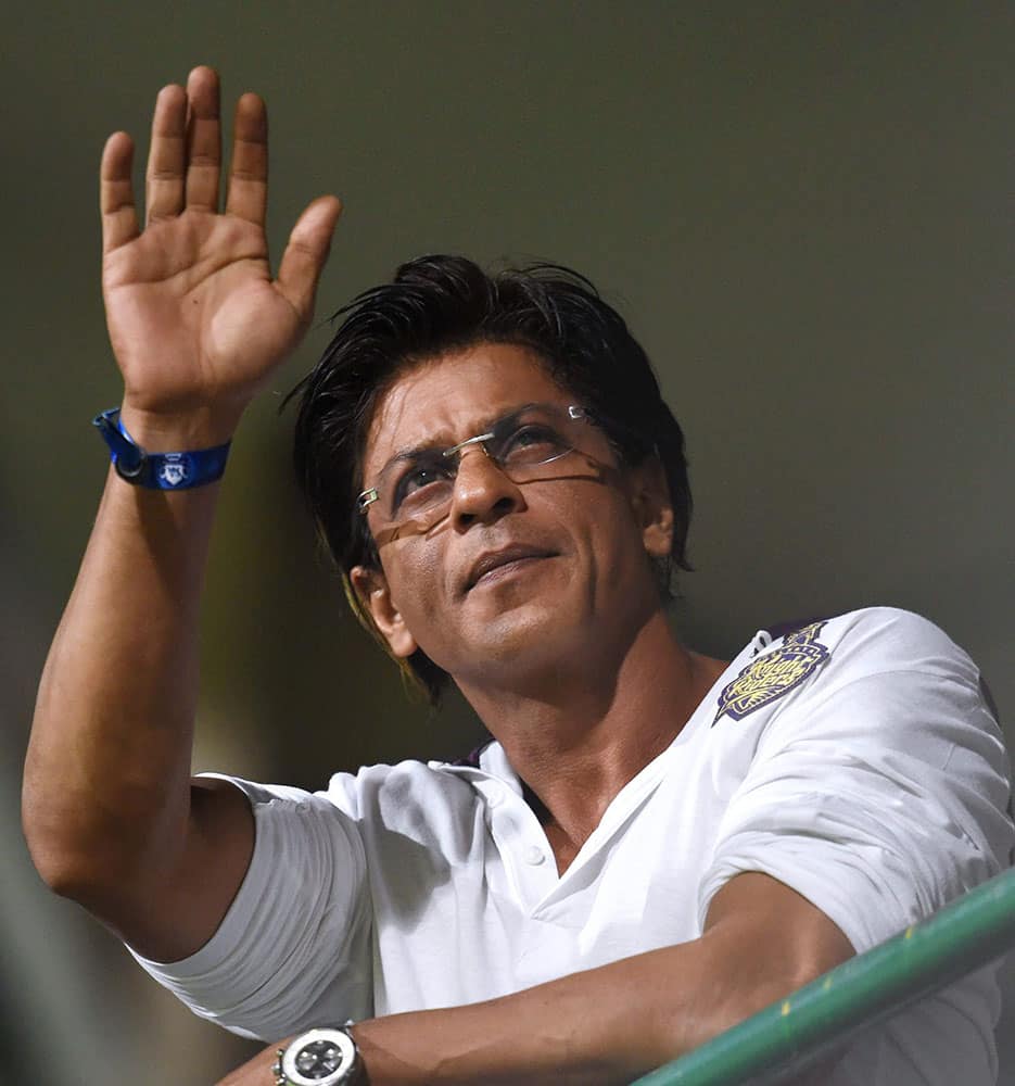 Kolkata Knight Riders Owner Shahrukh Khan waves to his fans during the IPL 7 Final match against Kings XI Punjab at M Chinnaswamy stadium, in Bengaluru.