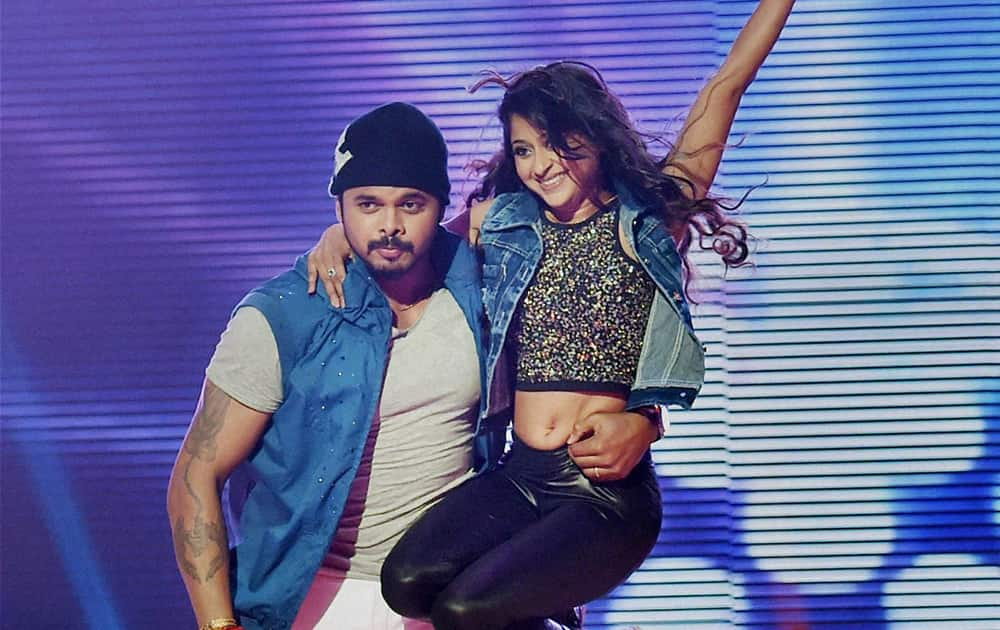 Cricketer S Sreesanth performs with choreographer Sneha during a promotional event for a TV show in Mumbai.