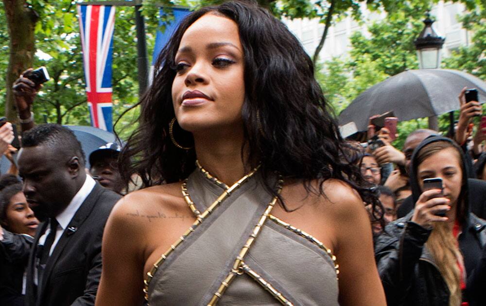 Singer Rihanna arrives at a French cosmetics chain to launch her perfume Rihanna Rouge on the Champs Elysee Avenue in Paris.