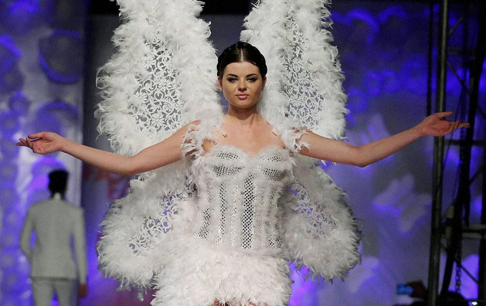 A model walks the ramp at the annual Fashionista Fashion Festival 2014 at Dilli Haat in New Delhi.