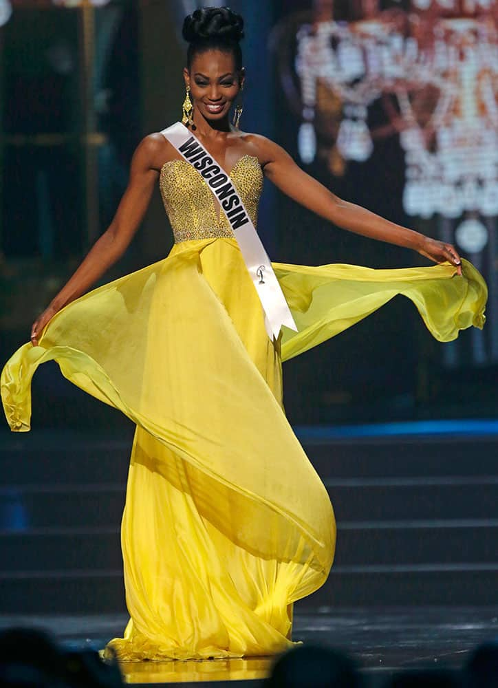 Miss Wisconsin USA Bishara Dorre participates in the evening gown competition during the 2014 Miss USA preliminary competition in Baton Rouge, La.