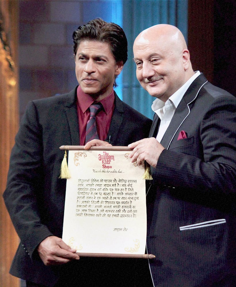 Bollywood actors Shahrukh Khan and Anupam Kher during a tv show in Mumbai.