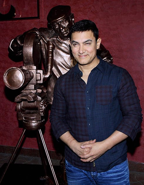 Aamir Khan poses during a promotional event in Mumbai.