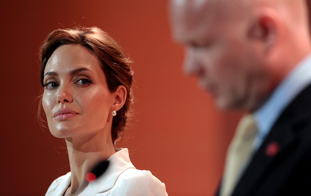 US actress and UN special envoy Angelina Jolie and British Foreign Secretary William Hague make their opening speech at the start of the Global Summit to End Sexual Violence in Conflict in London.