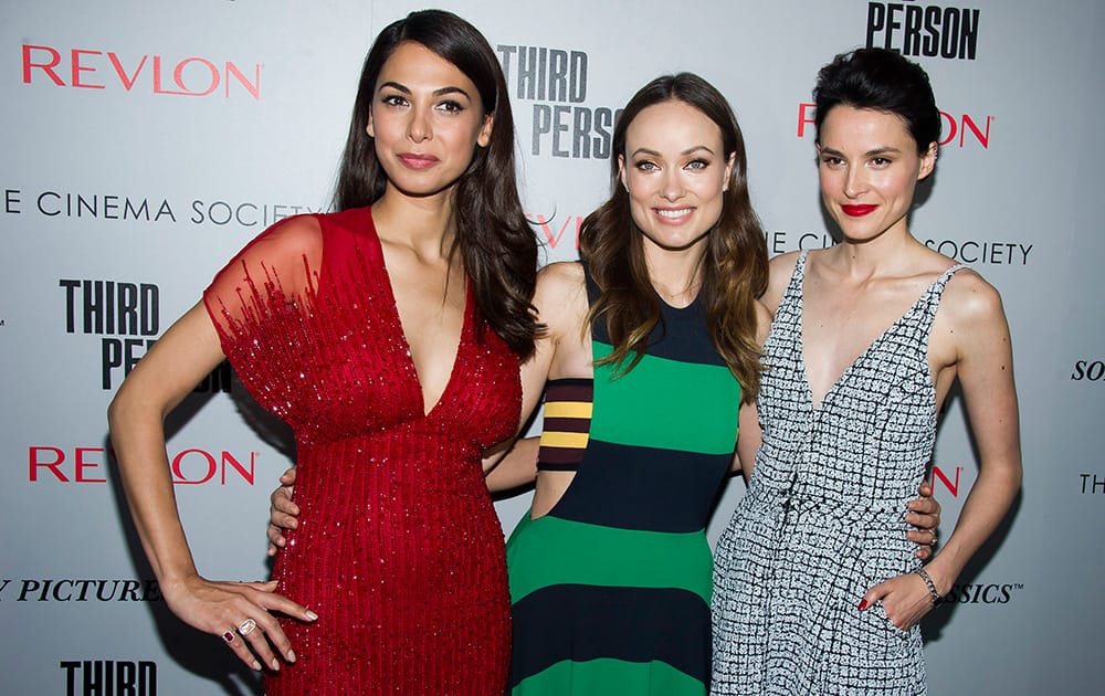 Moran Atias, Olivia Wilde and Loan Chabanol attend a screening of 'Third Person' hosted by the Cinema Society and Revlon, in New York.