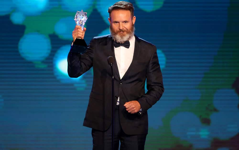 Mark Burnett accepts the award for best reality-competition series for 'Shark Tank' at the Critics' Choice Television Awards at the Beverly Hilton Hotel.