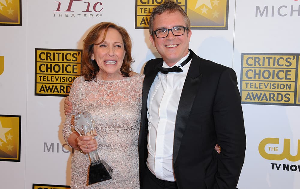 Ann Druyan and Brannon Braga pose in the press room with the award for best reality series for 'Cosmos: A Spacetime Odyssey' at the Critics' Choice Television Awards at the Beverly Hilton Hotel.