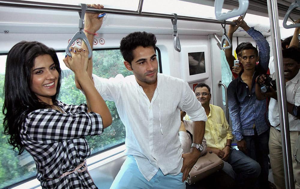 Bollywood actors Armaan Jain and Deeksha Seth take a ride in the newly launch Mumbai Metro train during the promotion of their upcoming film.