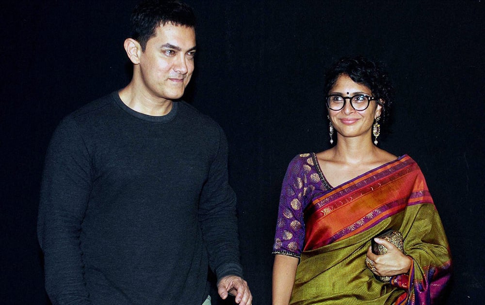 Aamir Khan with his wife, film producer & director, Kiran Rao during an Awards show in Mumbai.