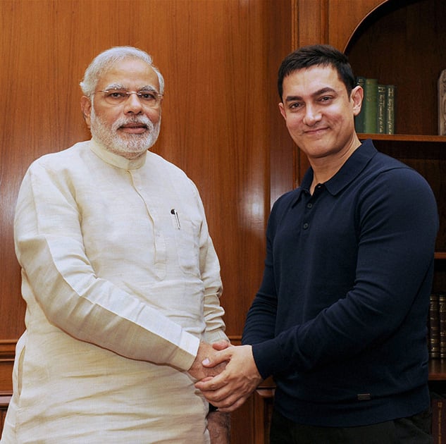 Prime Minister Narendra Modi shakes hands with actor Aamir Khan at a meeting in New Delhi.