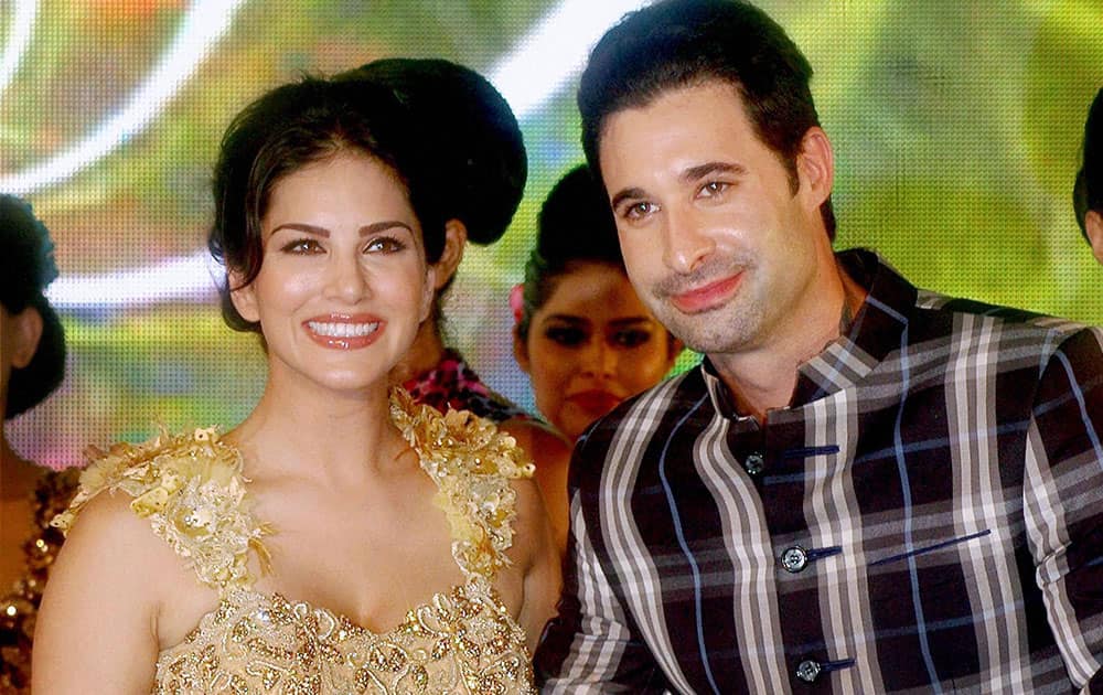 Bollywood actress Sunny Leone with her husband Daniel Weber during designer Rohit Verma's collection at a fashion show in Mumbai.