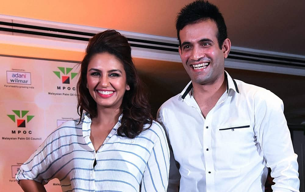 Irfan Pathan along with actor Huma Qureshi during the product promotion in Mumbai.