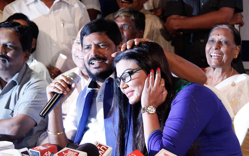 Rakhi Sawant and RPI chief Ramdas Athawale during a press conference where Rakhi officially became a member of the Republican Party of India in Mumbai. dna