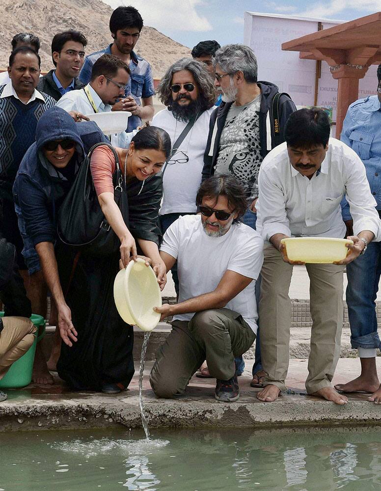 Actors Rajit Kapoor, Deepti Naval, film directors Rakyesh Omprakash Mehra, Amol Gupte and others stocking fish at the Sindhu river during the 'Leh International Film Festival' in Leh.