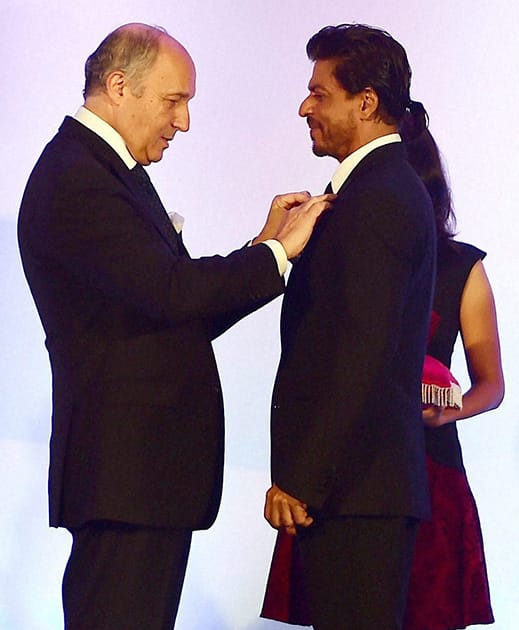 Bollywood superstar Shah Rukh Khan being conferred with Chevalier de la Legion d'Honneur, the highest Honour in France by Laurent Fabius, Minister for   Foreign Affairs and International Development of France in Mumbai.