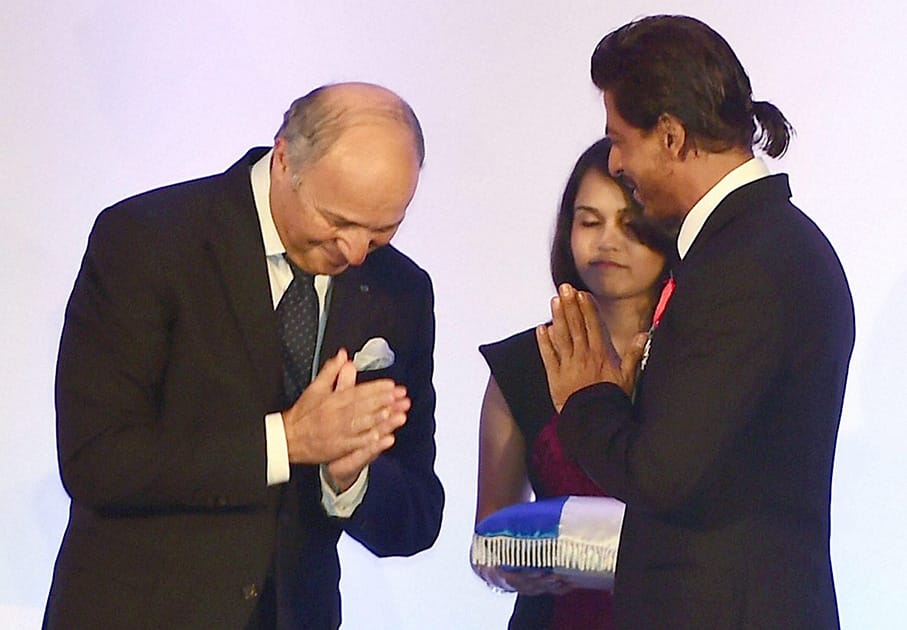 Bollywood superstar Shah Rukh Khan being conferred with Chevalier de la Legion d'Honneur, the highest Honour in France by Laurent Fabius, Minister for   Foreign Affairs and International Development of France in Mumbai.