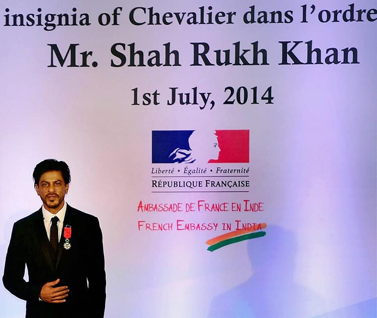 Bollywood superstar Shah Rukh Khan being conferred with Chevalier de la Legion d'Honneur, the highest Honour in France by Laurent Fabius, Minister for   Foreign Affairs and International Development of France in Mumbai.