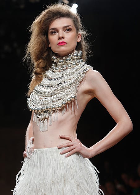 A model wears a creation for Serkan Cura's fall-winter 2014-2015 Haute Couture fashion collection presented in Paris.