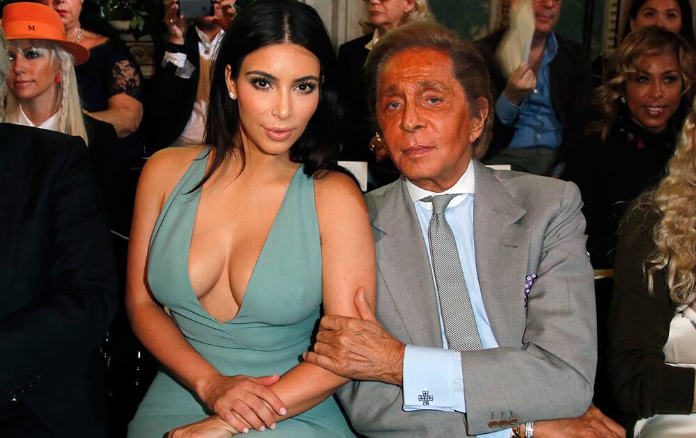 Kim Kardashian and fashion designer Valentino pose for photographers prior to the presentation of the Valentino Fall Winter 2014-15 Haute Couture fashion collection designed by Italian creative directors Maria Grazia Chiuri and Pier Paolo Piccioli, in Paris.
