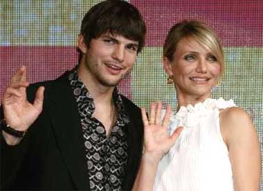 Cameron Diaz and Ashton Kutcher wave during an event to promote their film 