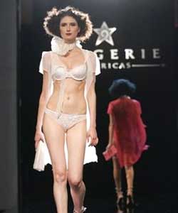 Model catwalks displaying a delicate lingerie creation during the French Lingerie part of the Lingerie Americas New York fashion show.