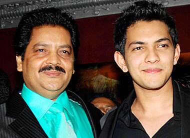 The father-son duo of Udit and Aditya Narayan pose at the latter's birthday bash.