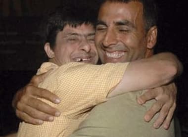 Akshay Kumar hugs a handicapped boy after the screening of a special show of his movie 