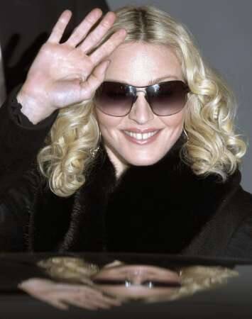  Madonna waves to supporters after leaving a news conference to present the film 'Filth and Wisdom' running at the 58th Berlinale International Film Festival in Berlin.