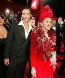 'Evita' star Madonna and Carlos Leon, father of their daughter Lourdes, arrive for the film's premiere Dec 14, 1996, at LA's Shrine Auditorium. Her performance as Eva Peron in the movie was widely pra