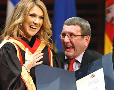 Celine Dion with Quebec's mayor Regis Labeaume after receiving an honorary doctorate in music from Laval University in Quebec.