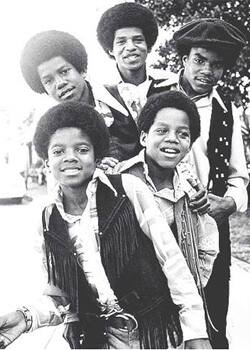 A fresh faced Michael Jackson with his brothers