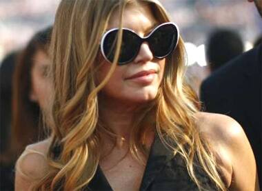 Singer Fergie poses for shutterbugs while attending the 2008 Democratic National Convention in Denver, Colorado. 