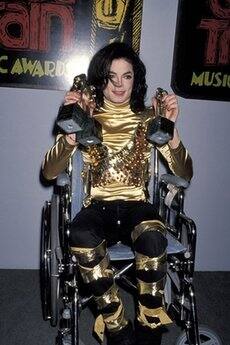 It's raining awards: Michael Jackson collects three trophies from the 7th Annual Soul Train Music Awards, March 1993.